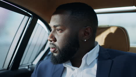 closeup worried business man feeling stressed at car. sad african man face