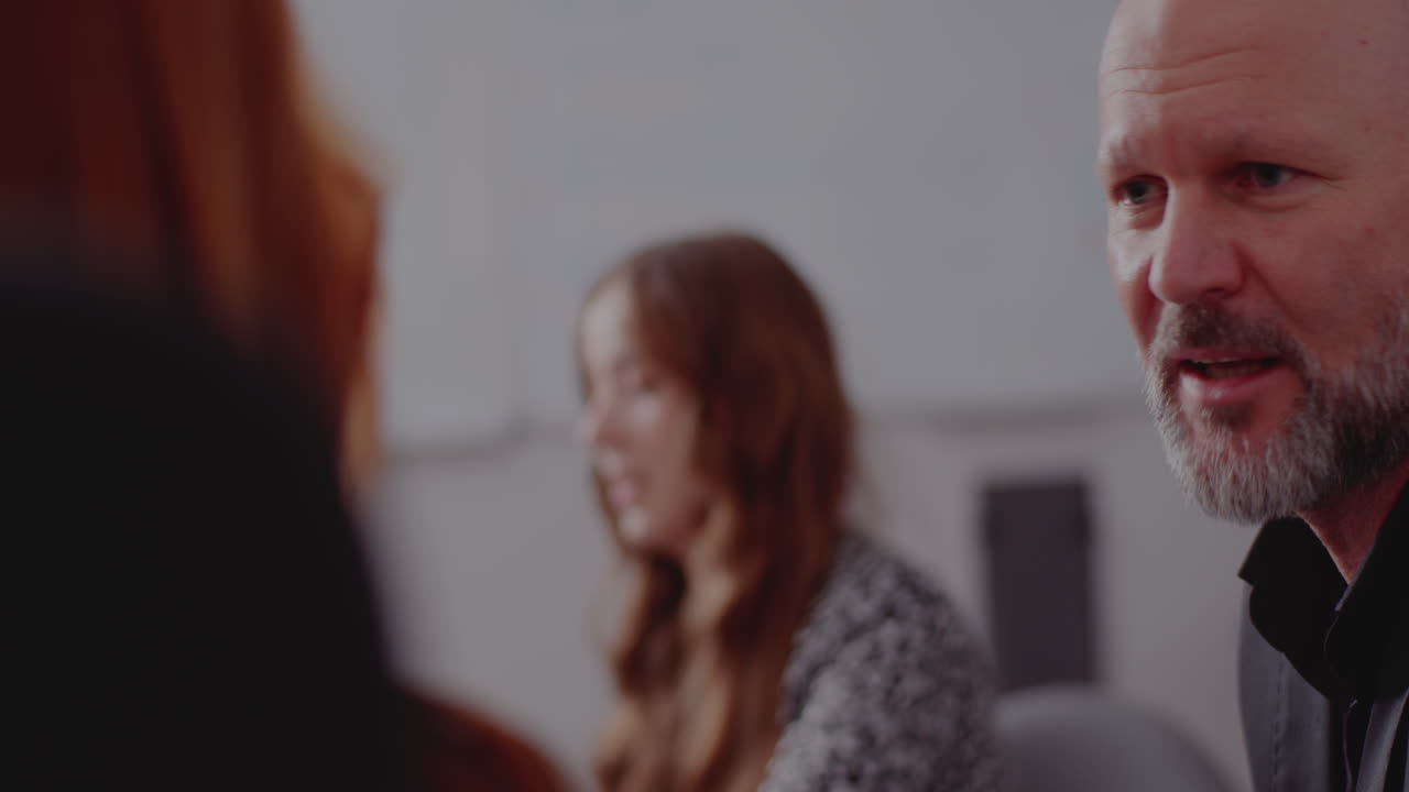 People having a meeting in an office