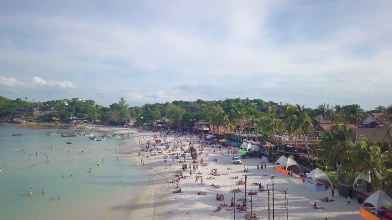 Low Altitude Aerial Flyby of  Haad Rin Beach After Full Moon Party, Koh Phangan Island, Thailand