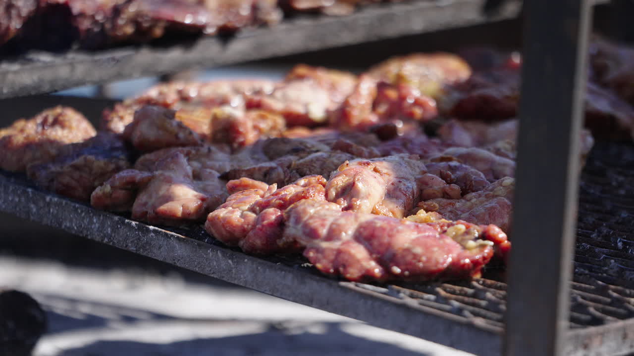 Delicious Argentinian beef cattle grilling as a Chinchulines specialty during outdoor cooking, Asado Argentino, Argentina.