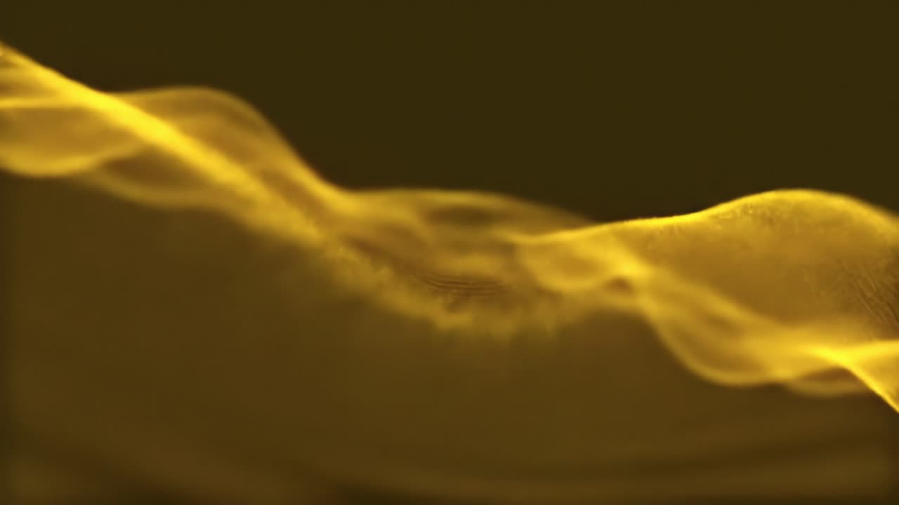 This captivating display showcases dynamic sound waves in stunning golden shades. The intricate patterns illustrate the beauty of sound and motion, creating a mesmerizing visual experience.