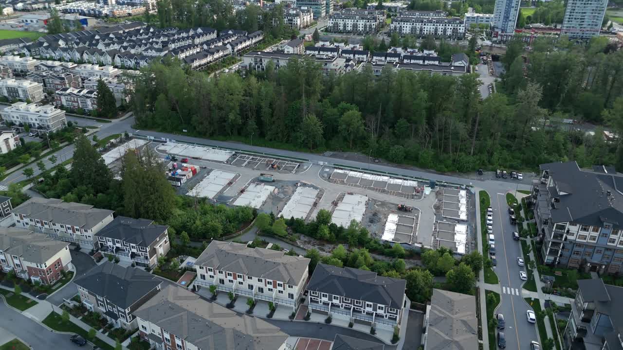 Vacant Lot Under Construction Near Townhouse Complex On The Willoughby In Langley Township, British Columbia, Canada. Aerial Drone Shot