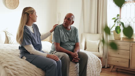 nurse comforting an elderly patient