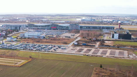 the vicinity of gdansk's lech walesa airport - a huge parking lot in front of the airport and developed transportation infrastructure