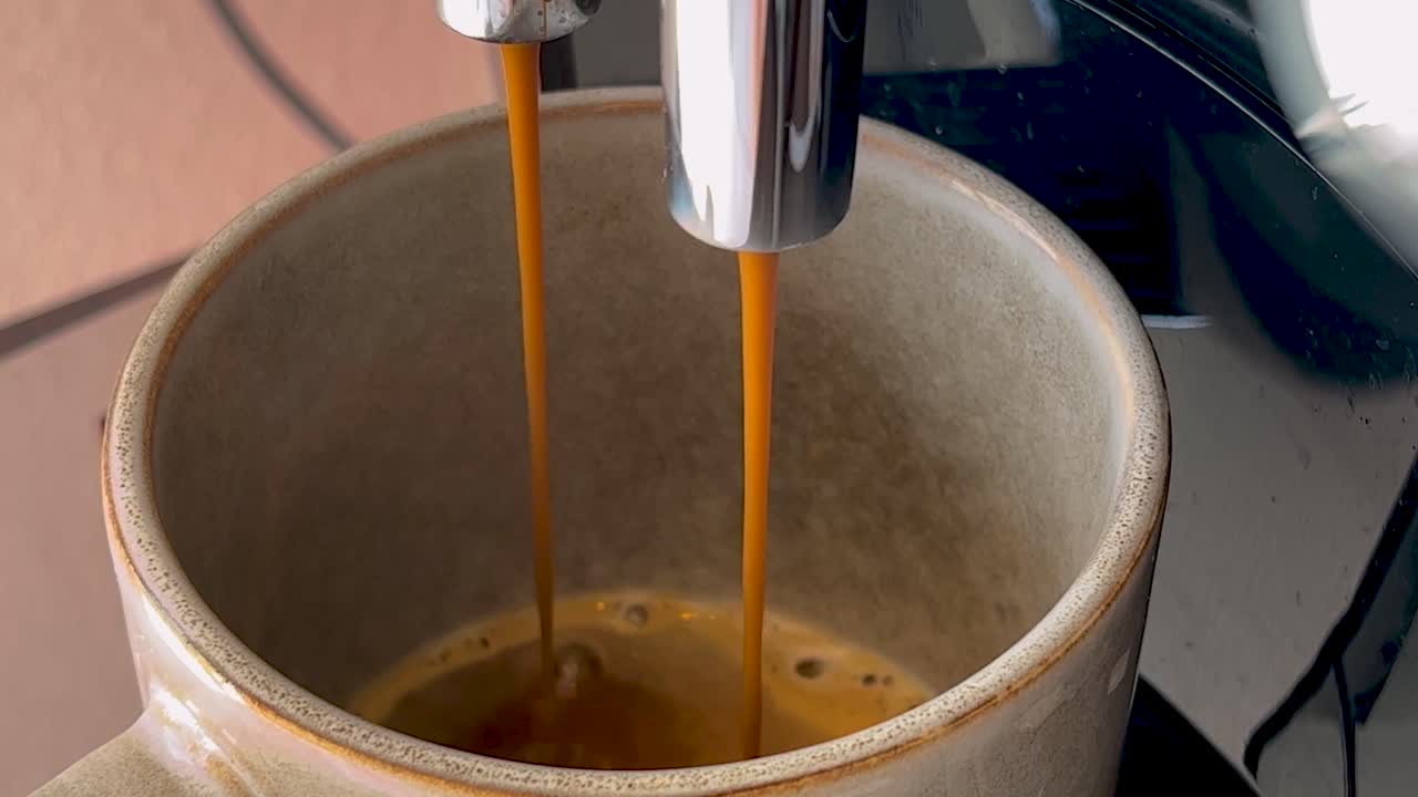 A cup of coffee is filled