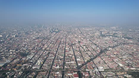 drone shot of mexico city during a very polluted day