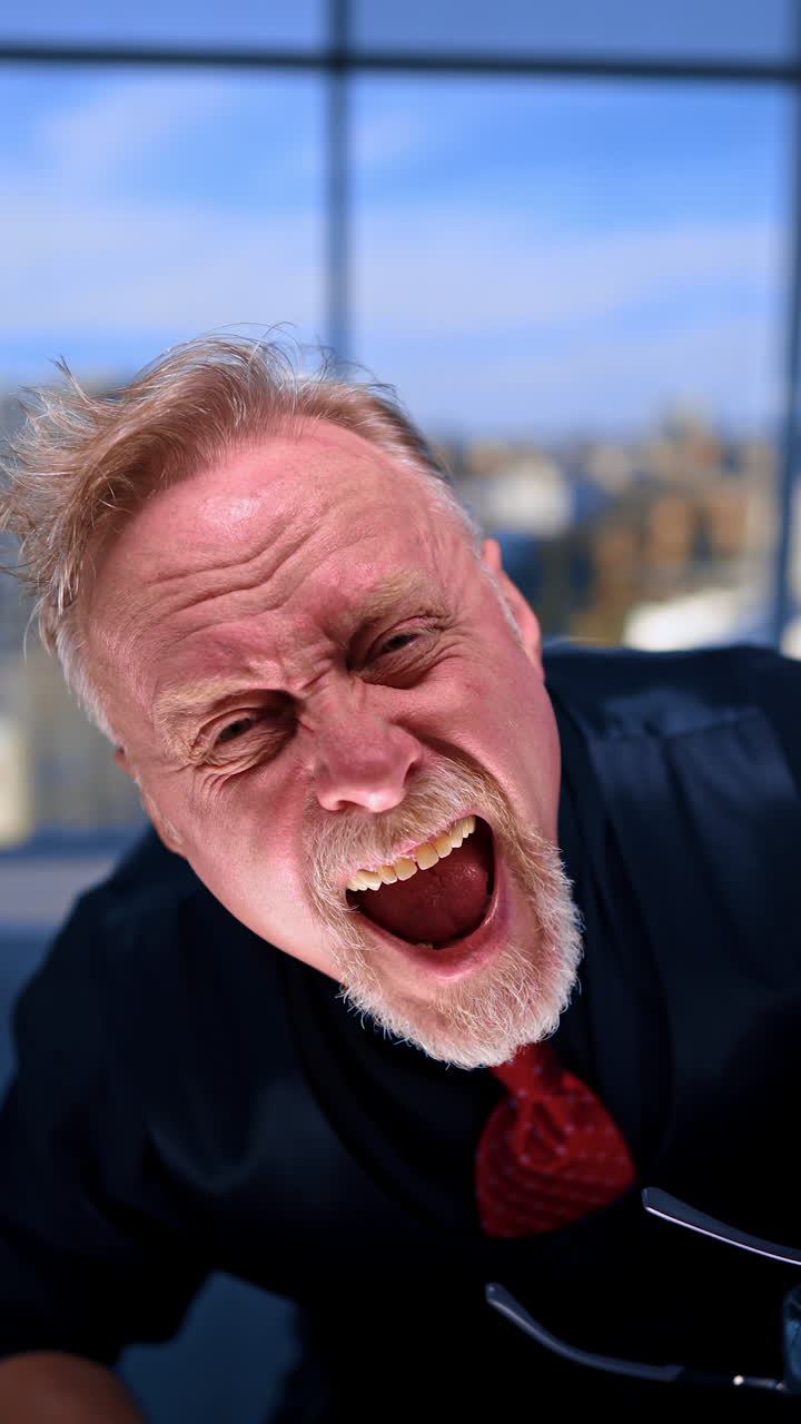 Shocked man wearing two pairs of eyeglasses. Adult Caucasian male takes off eyeglasses, shows surprise and pain and puts the accessory on back again. Close up. Vertical video.