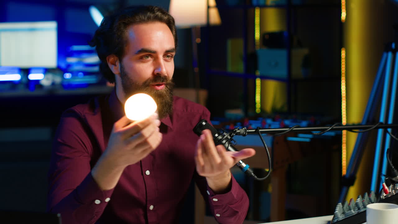 Smart light bulb presented by tech specialist in studio