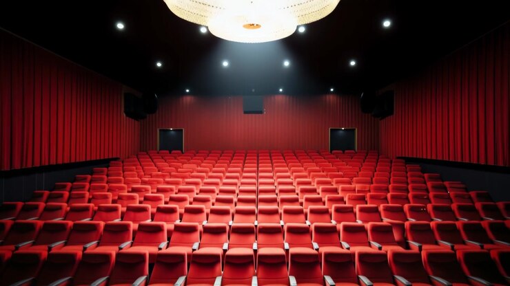 Empty Movie Theater with Rows of Red Seats