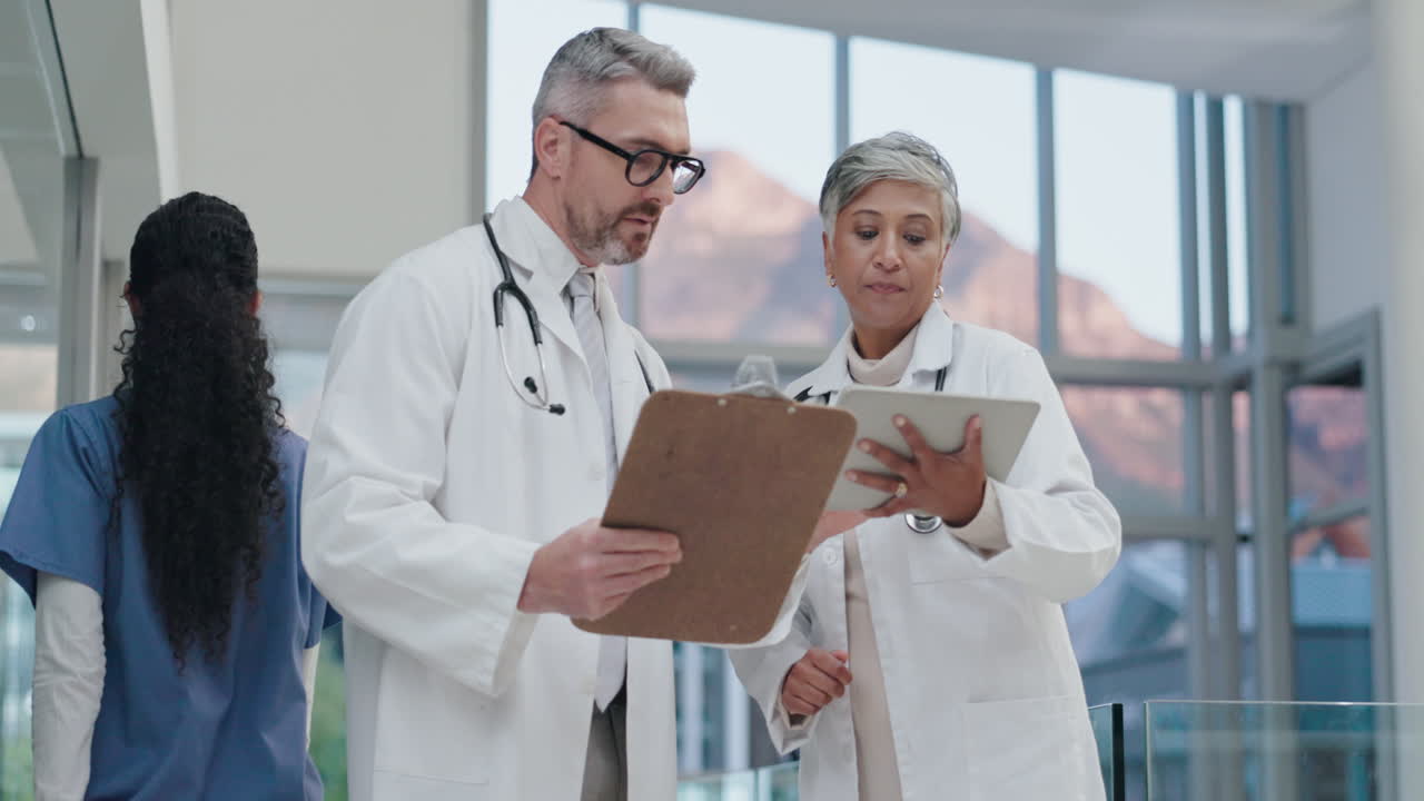 Teamwork, tablet or senior doctors speaking