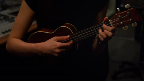 woman playing a guitar
