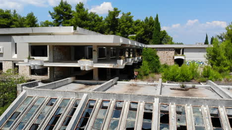 Aerial-drone-shot-of-an-old-abandoned-hotel-in-Jelsa,-the-island-of-Hvar,-Croatia