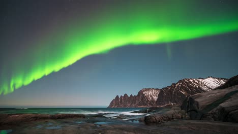 northern lights dance over rugged tungeneset coast, captured in stunning timelapse