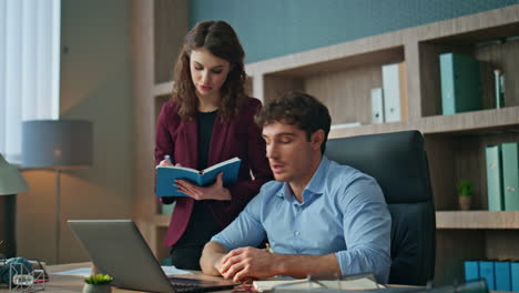 secretary writing boss instructions standing company office. ceo giving tasks