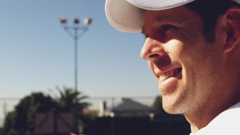 Man-playing-tennis-on-a-sunny-day