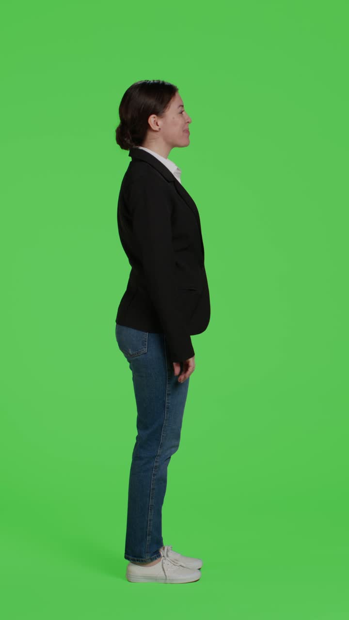 Vertical video: Profile of young businesswoman acting confident wearing suit