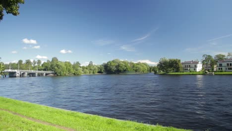 river scene with bridge and houses