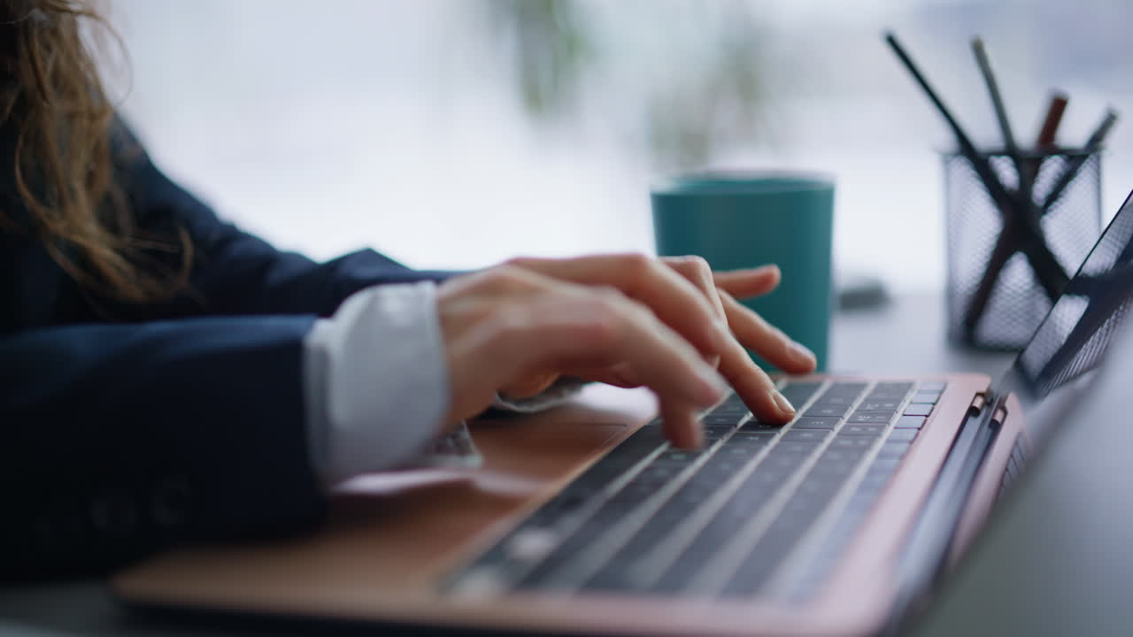 Lady fingers typing keyboard laptop making online research writing email closeup