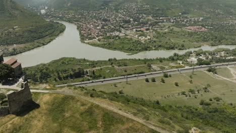 Panoramic-View-Of-Mtskheta-City-From-The-Mountaintop-Of-Jvari-Monastery-In-Mtskheta,-Eastern-Georgia