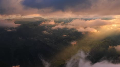 low clouds over a highland plateau in the rays of sunset. sunset on bermamyt plateau north caucasus, karachay-cherkessia, russia.