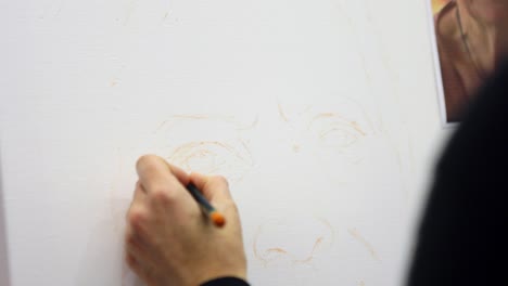 artist drawing outline sketch for portrait painting