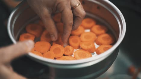 Preparing-carrots-for-steam-cooking