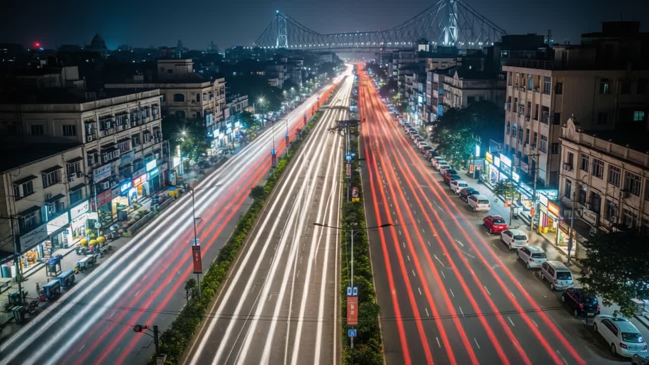 Dynamic Night Cityscape with Traffic Light Trails and Iconic Bridge