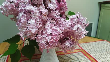 lilacs on a kitchen table on a sunny day