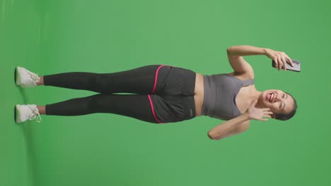 woman taking a selfie in sports clothes