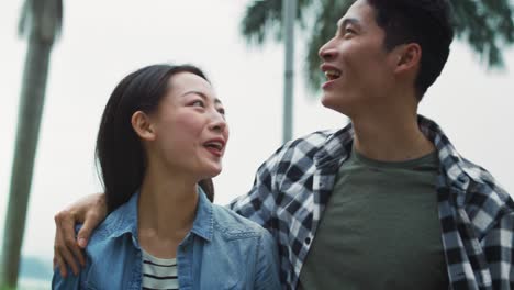 handheld view of vietnamese couple having happy time together