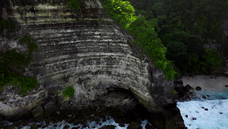 rocky wall of high cliffs of nusa penida, bali in indonesia