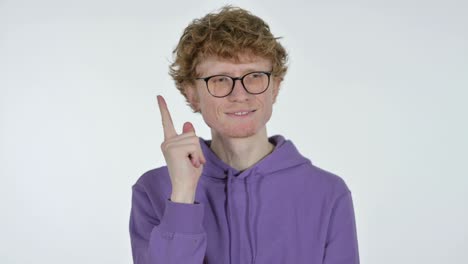 pensive redhead young man thinking, white background