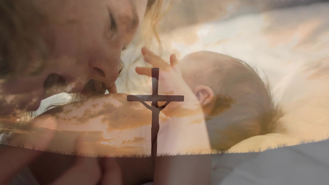 Mamma e bambino sdraiati in una scena di cura, la mamma si china sussurrando, il bambino si protende, con una sovrapposizione di nuvola a croce
