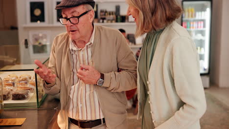 elderly couple shopping at a bakery