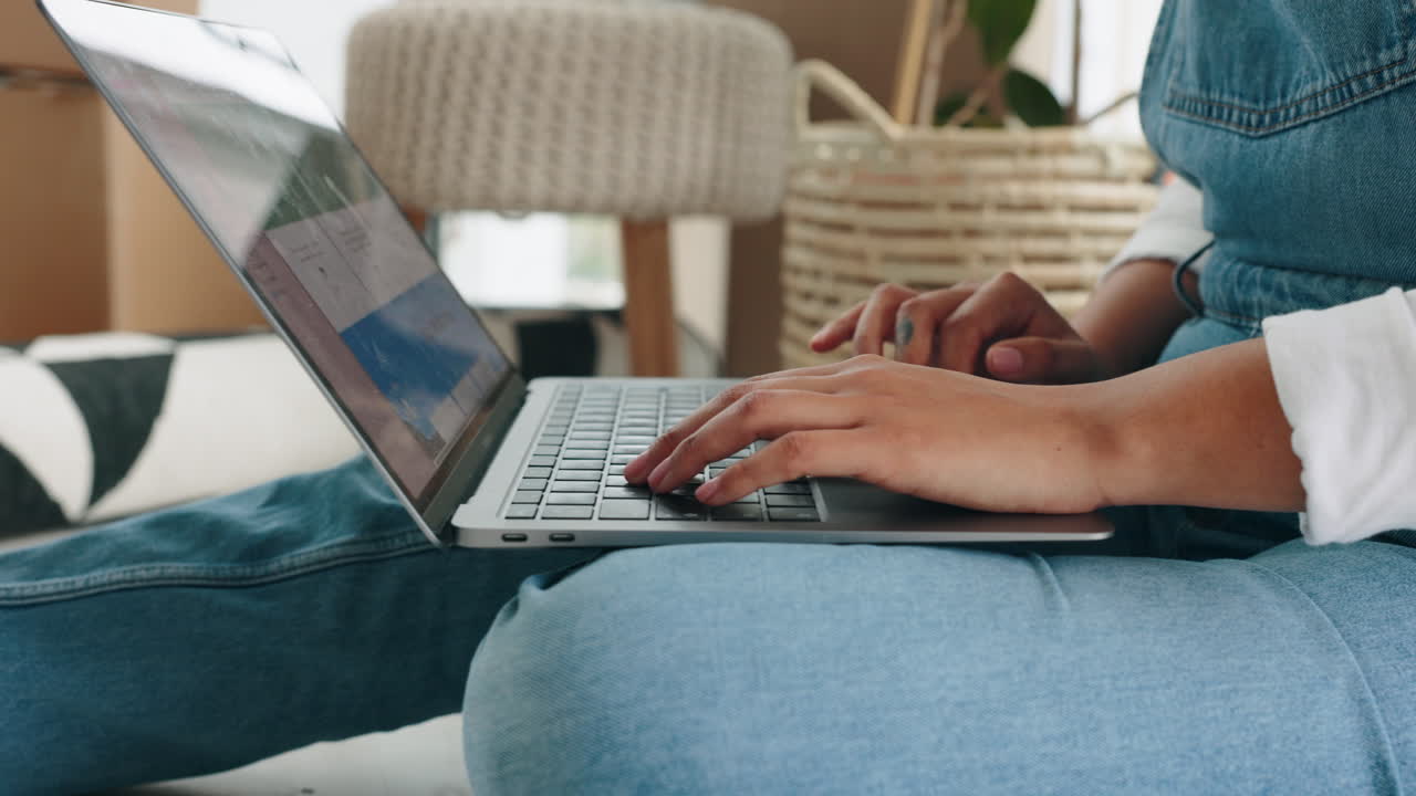 Black woman, laptop and moving into new home