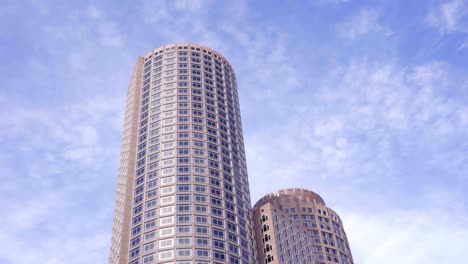 one international place building in boston, massachusetts against bright sunny sky