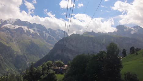 Gondola-ride-in-the-mountains-with-fir-forests-in-Grisons,-Switzerland