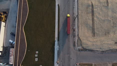 a long trailer truck travelling on the road in detroit, michigan on a sunny morning - aerial shot