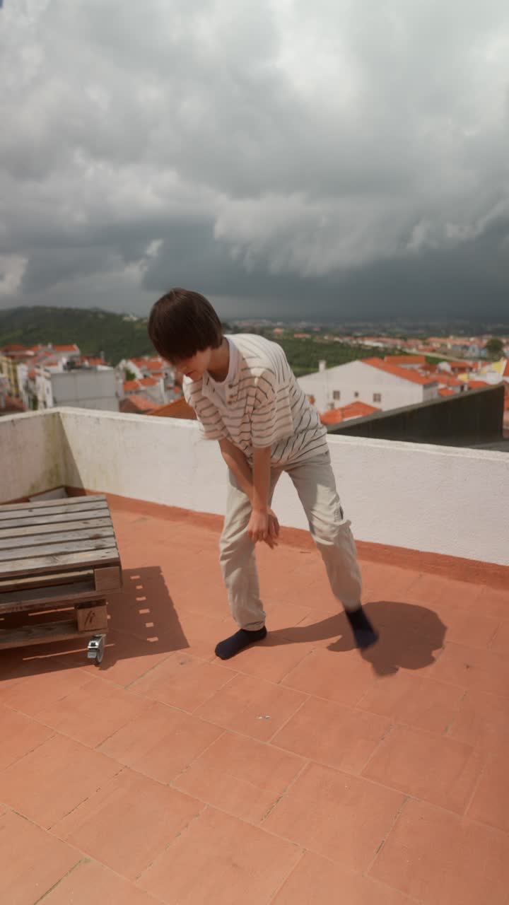 Child Dancing on a Rooftop
