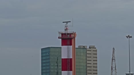 chennai lighthouse in marina beach with jm marina, marine towers, light pole and signal tower at marina beach, mylapore, chennai, tamil nadu, india. day time, close up shot, 4k