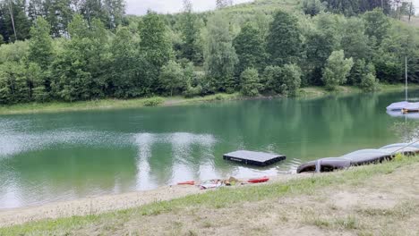 beach with shimmering black platform on a lake in germany