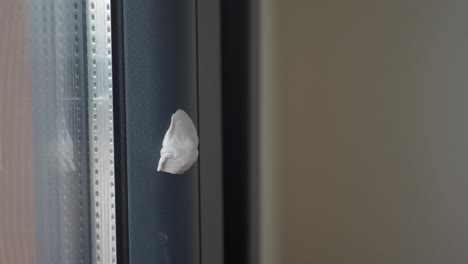 removing gum from a window