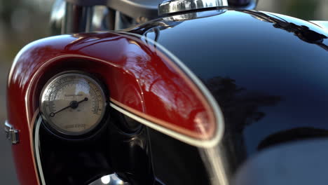 close-up detail of a vintage motorcycle's fuel tank and gauge