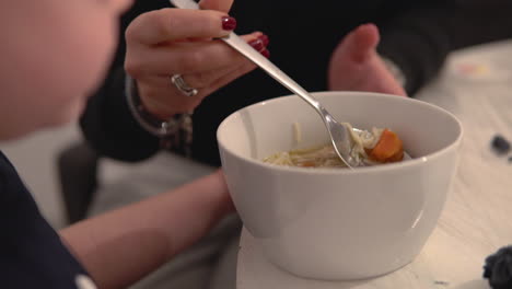 person enjoying a bowl of homemade soup