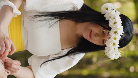 woman in white dress with daisy flower crown