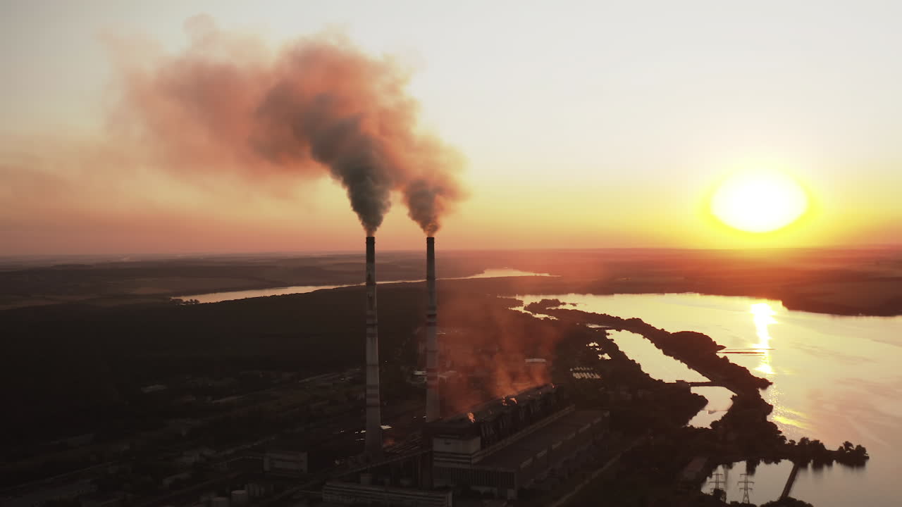 Static view of the power pylons on sunset time background. High voltage electric tower at the sunset. Fabric concept. Selective focus