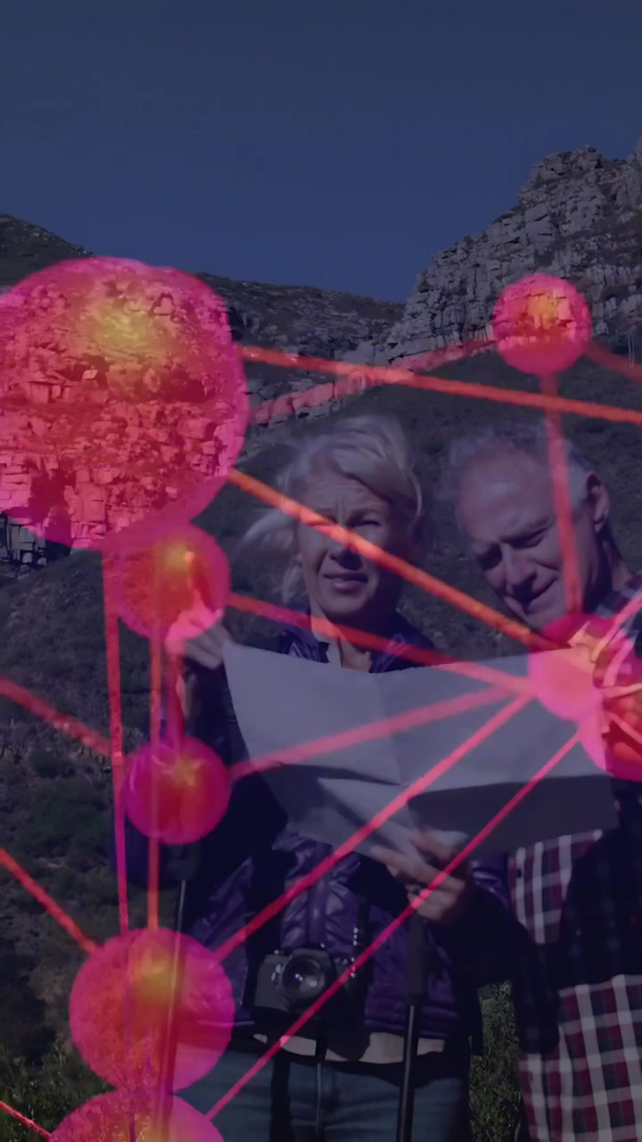 Vertical video: Woman and man reading paper map, touching map causing clear nodes guiding travel