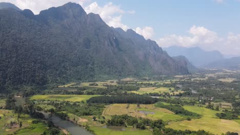 aerial view of farm fields with nam song river running through landscape