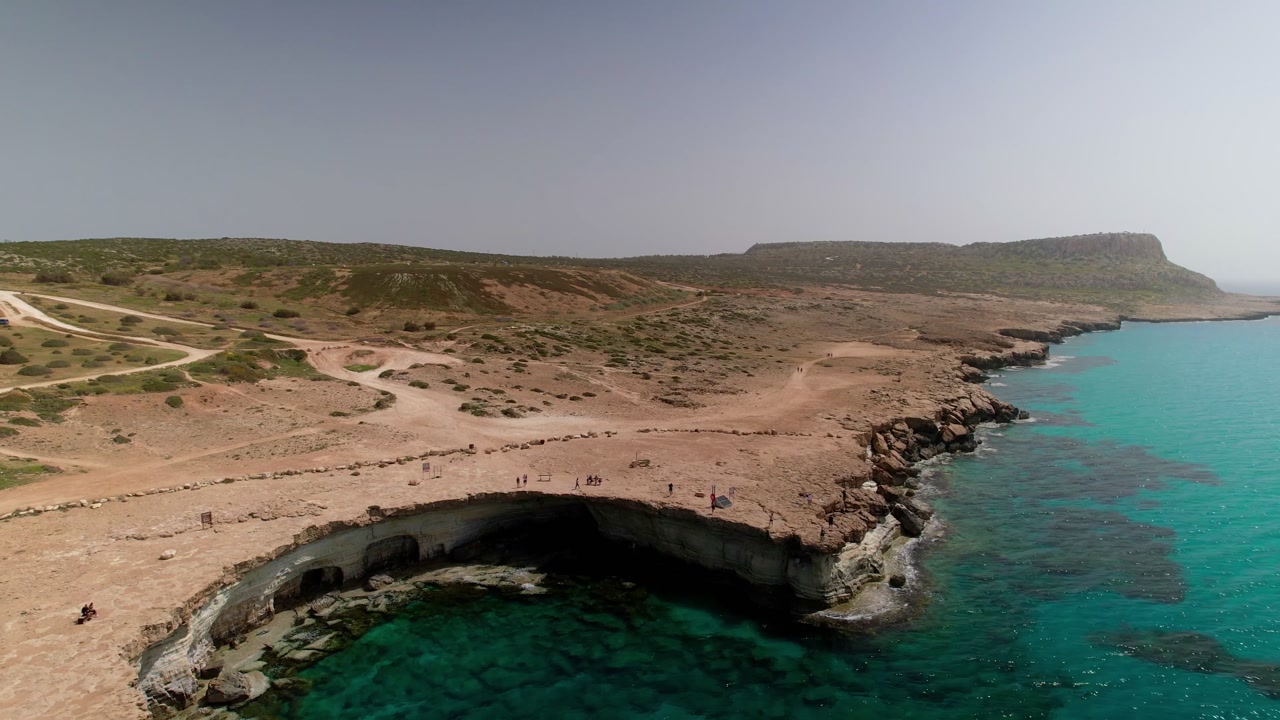 Panoramic aerial view revealing the stunning sea caves along the rugged coastline of ayia napa, cyprus