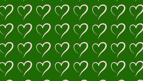 green background with pink hearts pattern